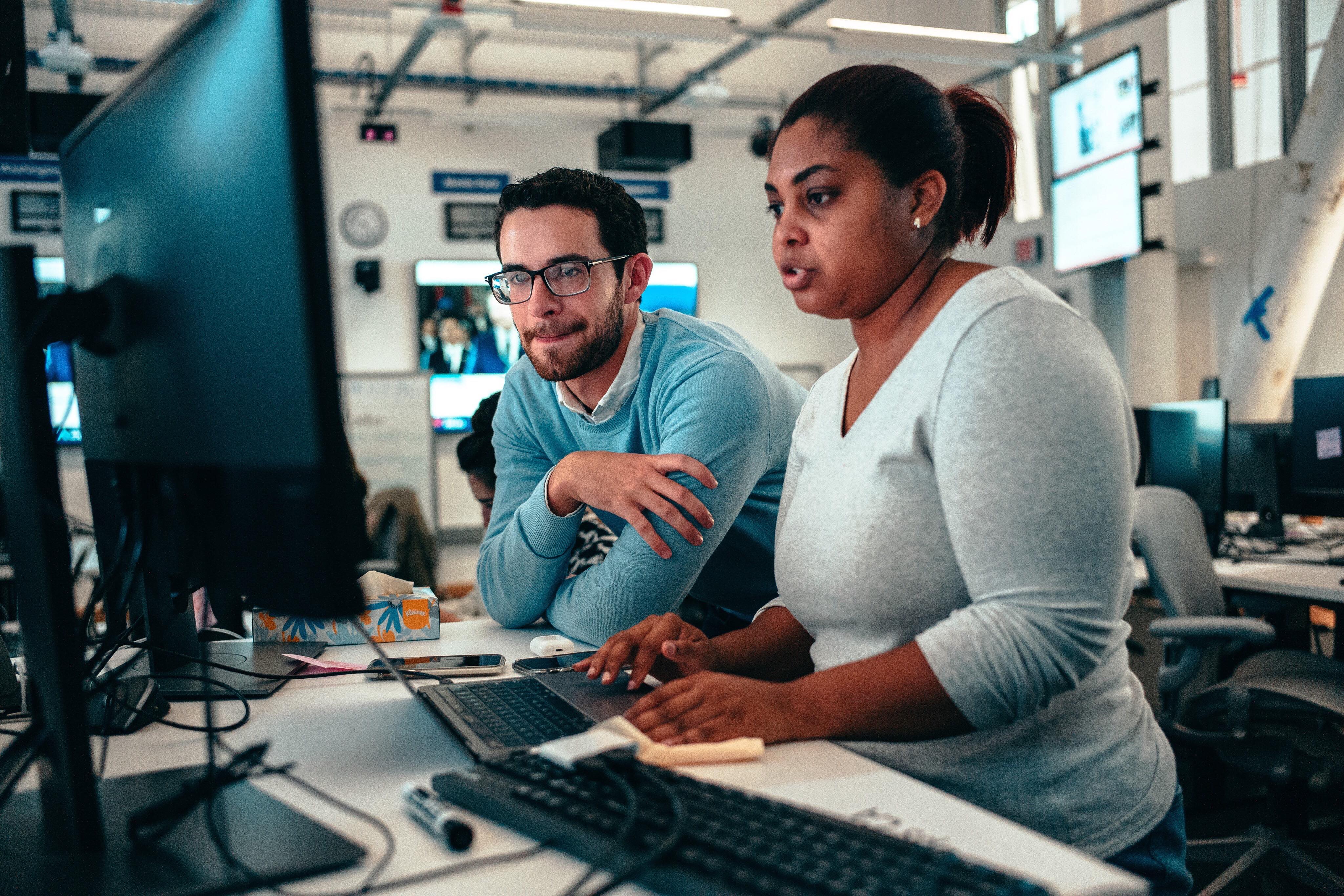 Photo of Facebook employees working on protecting election integrity.