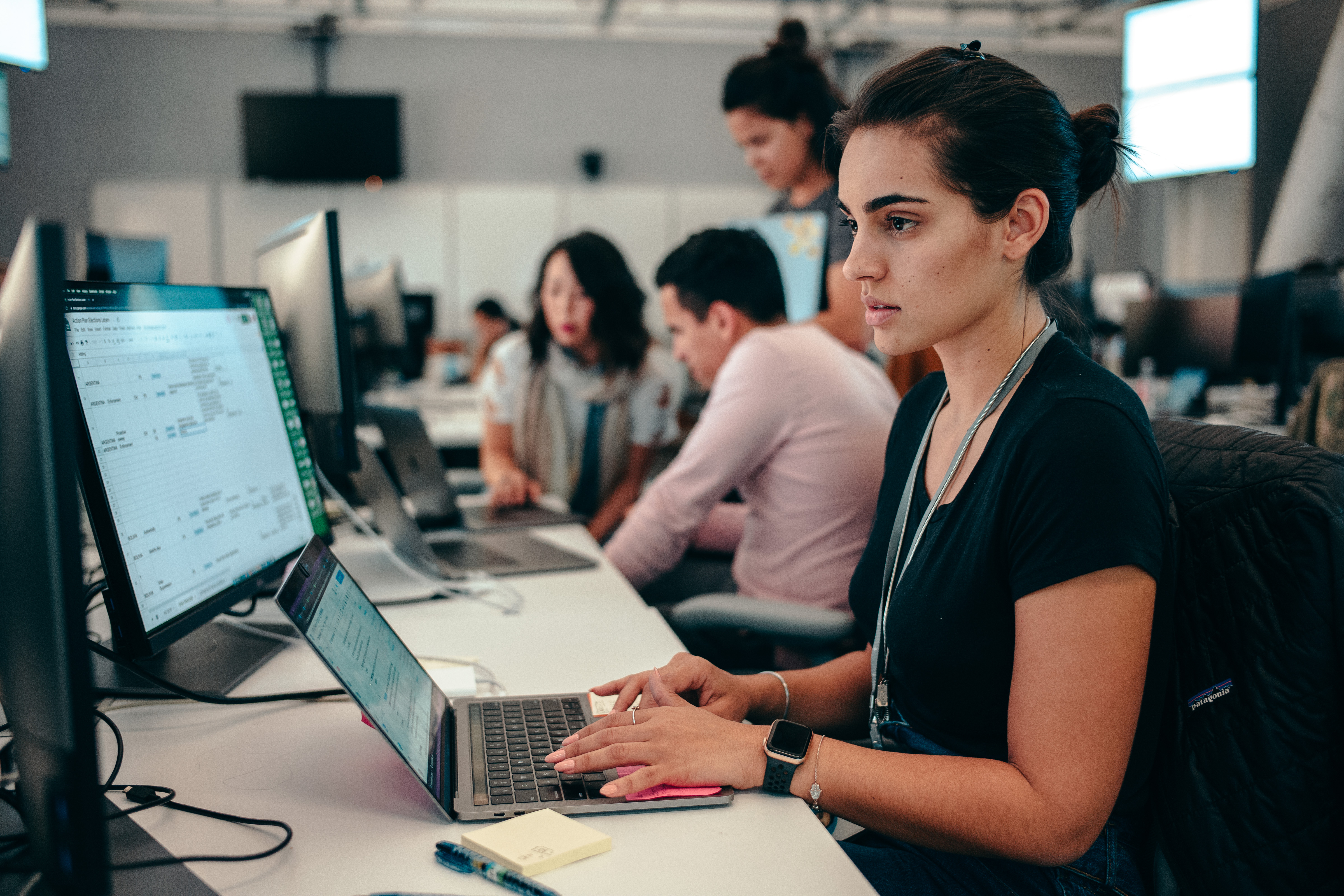 Photo of Facebook employees working in an elections war room.
