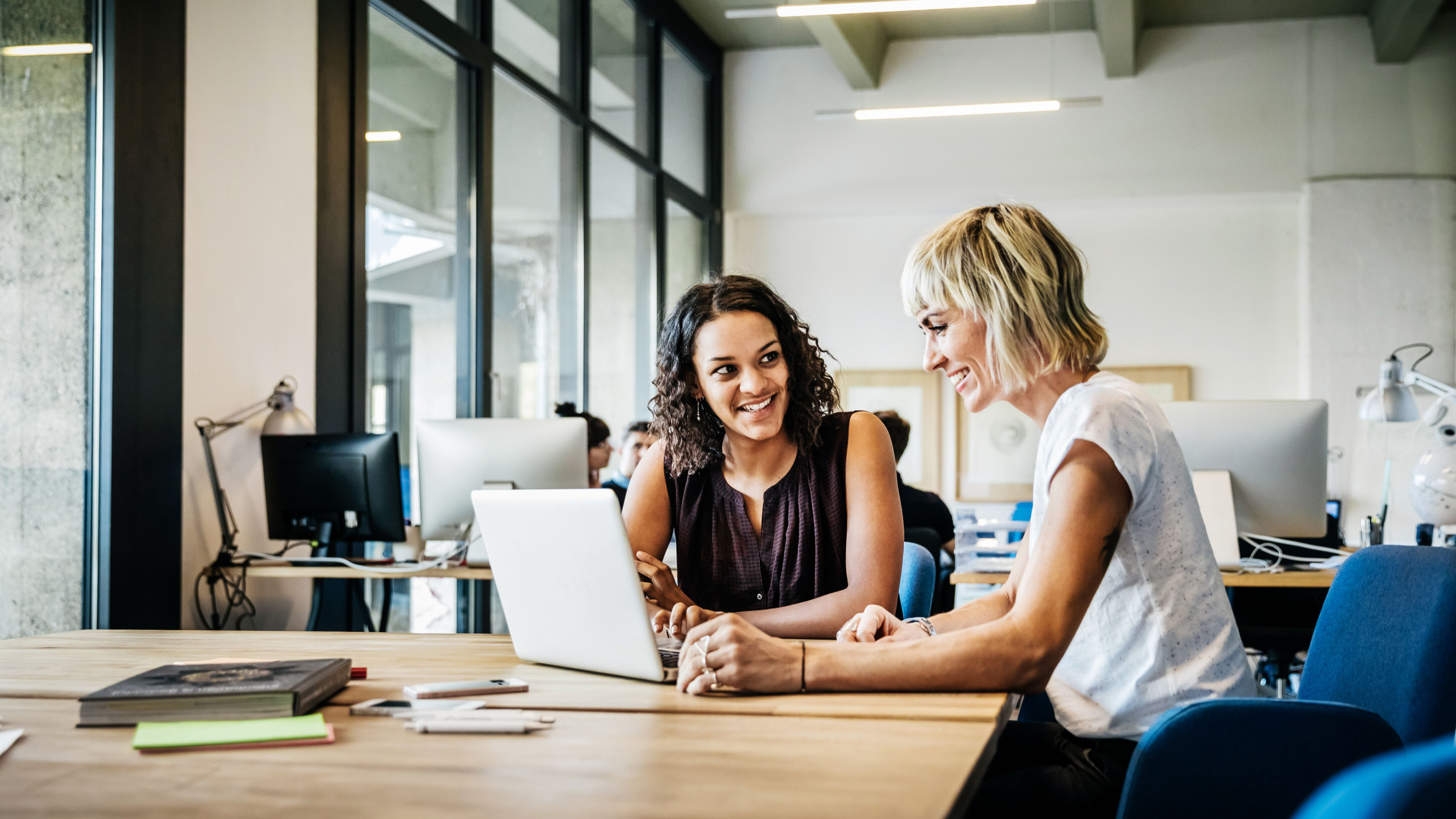Image of two women working