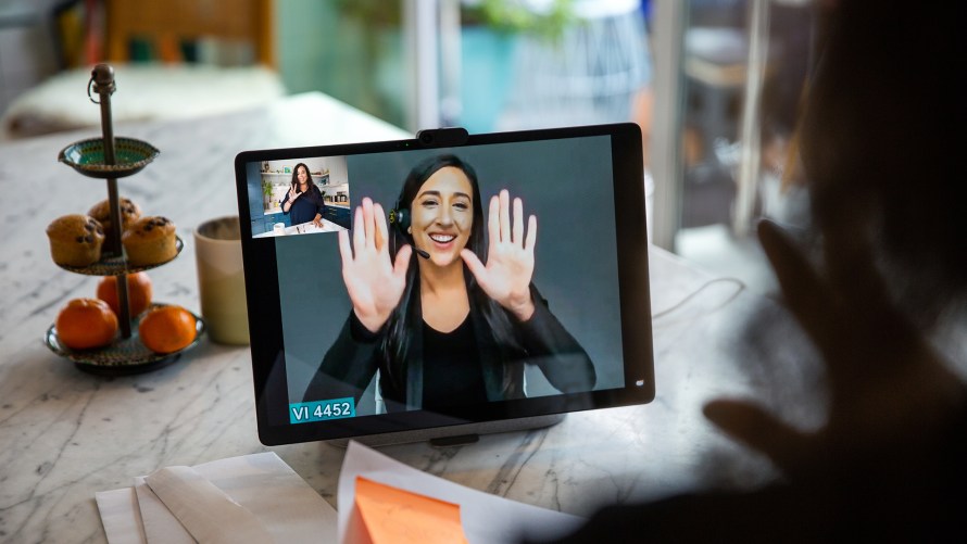 Photo of woman using Video Relay Services on Portal